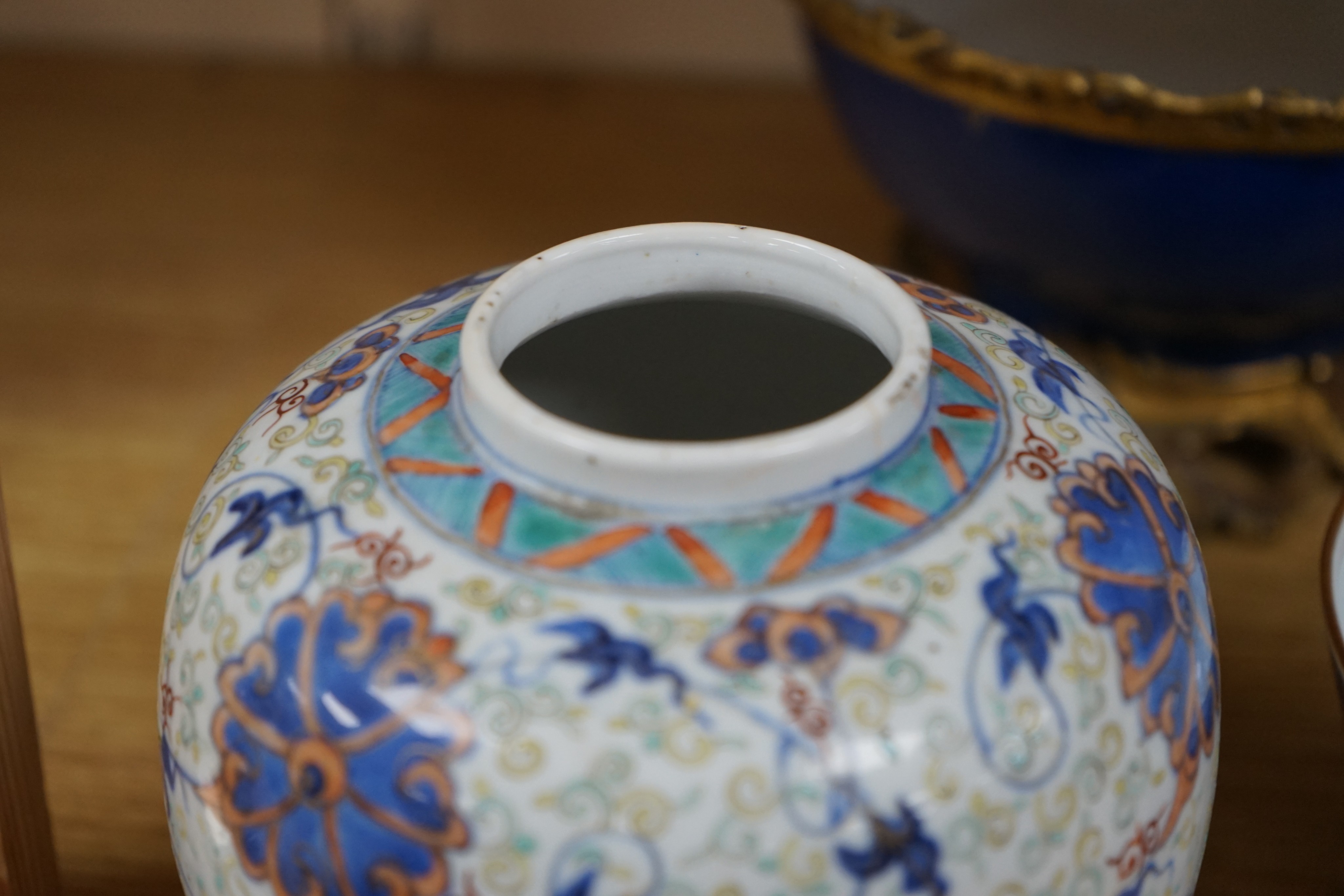 An 18th century Chinese clobbered blue and white bowl, a Samson powder blue ormolu mounted bowl, 19.5cm wide and a 19th century Chinese doucai style jar